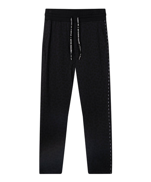 Front women banana pants tapered fit with low crotch made of supple scuba in black with leopard print